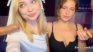 Two Slutty Babes Sucking Cock Side by Side