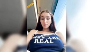 Brunette Woman Shows Natural Assets in Train Car – Yes They Are Real